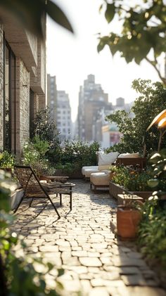 an outdoor patio with chairs and potted plants on the brick walkway between two buildings