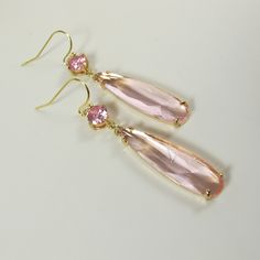 Soft Pink Crystal Earrings, Gold Dainty Pink Teardrop Earrings, Sparkly Dangle Earrings, Wedding Jewelry, Bridesmaid Gift, Pink Earrings. These beautiful and elegant drop earrings made with high quality, sparkly 24k gold framed, faceted pink glass crystals hang from tarnish resistant French ear hooks. These earrings are classic and elegant. Will make an excellent gift for yourself or friends. Measurements: The total length from the top of the hook to bottom - 2.04 inches (52 mm) approximately. C Pink Long Drop Earrings For Party, Party Teardrop Long Drop Earrings, Elegant Pink Teardrop Earrings, Delicate Linear Drop Earrings For Formal Occasions, Elegant Rose Gold Long Drop Earrings, Pink Teardrop Earrings For Formal Occasions, Feminine Party Earrings With Ear Wire, Elegant Pink Dangle Linear Earrings, Delicate Linear Earrings With Ear Wire For Formal Events