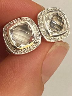 Pre owned Very good condition  100% Authentic David Yurman Albion Earrings 7mm x7mm Center white topaz Stone cushion cut 11mm  Diameter  ..25ct  Total estimated Diamonds Pave Setting 925 Sterling Silver 14K Gold Post  expedited shipping, signature is required White Diamond Gemstone Earrings For Formal Occasions, Formal White Diamond Gemstone Earrings, White Diamond Earrings For Formal Occasions, Anniversary Earrings With Diamond Accents And White Topaz, Luxury White Topaz Earrings For Anniversary, White Topaz Earrings For Anniversary, Luxury Clear Earrings For Formal Events, White Diamond Gemstone Earrings For Anniversary, Anniversary White Topaz Earrings In Diamond White