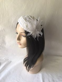 This is a vintage inspired half hat feather flower fascinator ideal for wedding, bridal tea party, mother of the bride, COGIC church hat or any other formal special occasion. Lightweight Can be worn either side Alligator clips underneath or elastic band White Vintage Wedding Costume Hats And Headpieces, Elegant White Handmade Mini Hat, Vintage White Costume Hats For Wedding, Vintage White Costume Hats And Headpieces For Wedding, Vintage White Wedding Costume Hats And Headpieces, Elegant Handmade White Mini Hats, Gatsby Style Wedding Headband Hat, Flapper Style Wedding Fascinator, Vintage White Headpieces For Wedding