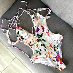 Never Worn But I Took The Tags Off. No Cups Or Padding Floral Print One-piece Bodysuit For Beachwear, Spring Vacation Floral Print Bodysuit, Multicolor One-piece For Spring Vacation, Spring One-piece Bodysuit For Poolside, Floral Print One-piece Bodysuit For Beach Party, Sleeveless Floral Print One Pieces For Summer, Sleeveless Floral Print One-pieces For Summer, Tropical Spring Bodysuit For Poolside, Tropical Spring Bodysuit For Pool