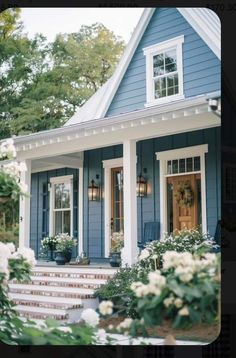 a blue house with white trim and windows