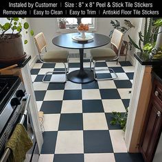 a kitchen with black and white checkered flooring next to a stove top oven