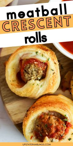 meatball crescent rolls on a cutting board with sauce in the background and text overlay that reads meatball crescent rolls