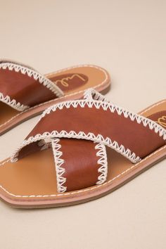 The Lulus Gaelle Tan Square-Toe Slide Sandals are essential for making this summer has sensational as possible! These cute, faux leather sandals start with a single sole silhouette that features a square footbed and wide, crisscrossing vamp straps trimmed with Boho-chic stitching. The sleek and simple slide-on design makes for convenient styling! 0. 25" rubber heel. Smooth insole. Rubber sole has nonskid markings. Man made materials. Imported. Lulus | Gaelle Tan Square-Toe Slide Sandal Heels | S Tan Square, Sandal Heels, Swimming Outfit, Rubber Heels, Women's Summer Fashion, Slide Sandals, Leather Sandals, This Summer, Boho Chic