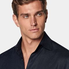 This casual navy tailored fit shirt is cut to a shorter length for versatile styling, and crafted with ultra-fine stitching, heat-sealed buttons and classic widespread collar. Navy Business Top With Spread Collar, Navy Slim Fit Collared Shirt, Navy Collared Slim Fit Shirt, Classic Navy Semi-formal Tops, Classic Navy Shirt With Button Closure, Formal Navy Collared Top, Business Tops With Welt Pockets And Spread Collar, Navy Formal Tops With Button Closure, Navy Fitted Tops With Spread Collar