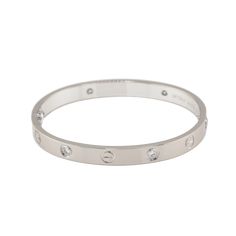 Cartier Love Bracelet in 18K White Gold set with 4 brilliant-cut diamonds totaling 0.42 carats Total Diamond Weight: 0.42ct Bracelet Size: 16 Created in New York in 1969, the LOVE bracelet is an icon of jewelry design: a close-fitting, oval bracelet composed of two rigid arcs which is worn on the wrist and removed using a specific screwdriver. The closure is designed with two functional screws placed on either side of the bracelet. Ref. B6070117 SKU: CAR01380 Original box and original papers Ple Oval Bracelet, White Gold Set, Love Bracelet, Cartier Love, Cartier Love Bracelet, Love Bracelets, Gold Set, Bracelet Sizes, Brilliant Cut Diamond