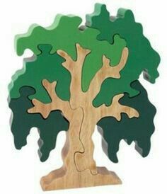 the wooden puzzle is shaped like a tree with green leaves and brown branches on it