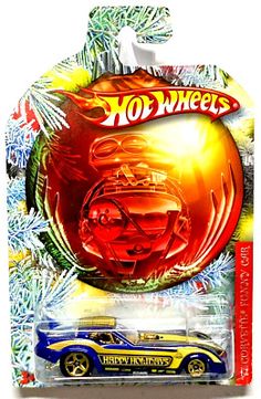 a hot wheels christmas ornament with an orange and blue car in the background