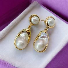 🌟Elevate your elegance with our stunning White Keshi Pearl Stud Earrings. Featuring gold-plated settings and baroque pearls, these earrings are perfect for weddings and special occasions. The unique nucleated flameball design adds a touch of luxury and sophistication, making them an ideal gift for women who appreciate timeless beauty. ✨ Features:  * Gold-plated stud earrings  * Genuine white Keshi baroque pearls  * Unique nucleated flameball design  * Perfect for weddings and special occasions Luxury Handmade Traditional Pearl Earrings, Elegant Plated Clip-on Earrings For Formal Occasions, Elegant Plated Clip-on Earrings For Formal Events, Exquisite Gold Clip-on Earrings, Elegant Plated Wedding Earrings, Formal Drop Earrings With Baroque Pearls, Classic Gold Baroque Earrings, Yellow Gold Baroque Pearl Earrings For Anniversary, Luxury Gold Earrings For Wedding