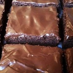 chocolate brownies with frosting on top of each one