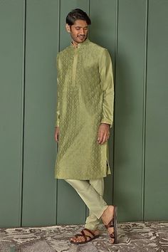 Olive green chanderi kurta with all over floral jaal pattern and tonal resham embroidery. Paired with contrast pyjama. - Aza Fashions Ceremonial Tussar Silk Kurta For Transitional Season, Transitional Ceremonial Tussar Silk Kurta, Designer Green Silk Sherwani, Traditional Green Silk Sherwani, Green Tussar Silk Kurta With Resham Embroidery, Pista Green Raw Silk Kurta For Transitional Season, Green Chanderi Bandhgala With Cutdana, Transitional Pista Green Raw Silk Kurta, Ceremonial Festive Tussar Silk Kurta