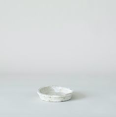 a white bowl sitting on top of a table