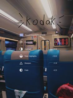 the seats on this train are labeled kodak and features information about their location in english