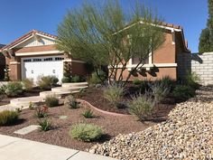 a house with landscaping in front of it