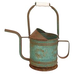 an old metal watering can with a handle