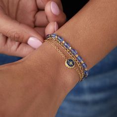 Every journey begins with the first step. When you’re ready to embark on what’s next, wear the Stranded Compass Bracelet Set which features three bracelet strands. One has a compass symbol on a gold cable chain to guide you on your path, one has sparkling light sapphire faceted glass beads, and one gold figaro chain. The Stranded Collection features an all new, interchangeable design. Bracelet strands attach to an adjustable-length keeper, included with the set. Swap out strands from different p Compass Symbol, Gold Figaro Chain, Compass Bracelet, A Compass, Sparkling Lights, Light Sapphire, Design Bracelet, Figaro Chain, Figaro Chains