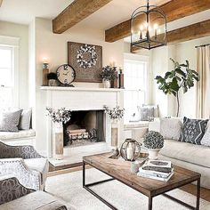 a living room filled with furniture and a fire place in the middle of a room