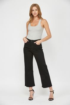 A timeless essential, the Black Beauty Wide Leg Crop Jeans bring effortless sophistication to everyday dressing. Crafted with a lightweight cotton-blend in a classic dark wash, this luxurious style is designed to contour your figure for a flattering fit. Style them with a breezy blouse and polished pumps for a chic ensemble. 69% Cotton, 30% Polyester, 1% Spandex Black Wide Leg Jeans, Crop Jeans, Wide Leg Denim, Black Beauty, Denim Outfit, Cropped Jeans, Wide Leg Jeans, Long Tops, Short Tops