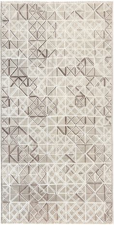 a rug with an abstract design in grey and white colors, on a white background