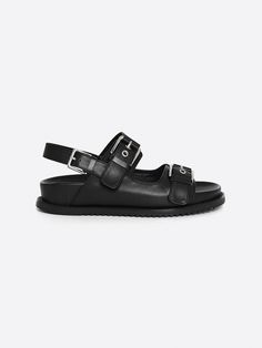 Editor's NotesRareness' shoes are designed for comfortable and basic styles.- Bold buckled double strap sandals- Cushioned sole bottom- Subtle glossy leather- Easy slide-in design- Modern almond toe shapeMeasurements(in.)- Size: KR 225MM (US 5.5) ~ KR 250MM (US 8)- Heel Height: 1.2 in.*Fits true to size.Composition & Care- Calf Leather- Lining: Pigskin Leather- Insole: Kidskin Leather- Avoid direct heat and moisture- Professional cleaning is recommendedDesigner- by rareness Double Strap Sandals, Pig Skin, Slide In, Professional Cleaning, Basic Style, Bold Fashion, Design Modern, Strap Sandals, Black Sandals