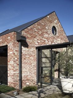 an old brick building with a glass door