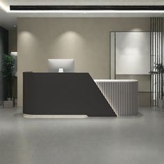 an empty reception area with two desks and a plant in the corner on the right