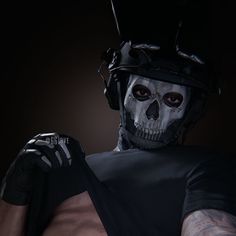 a man wearing a skeleton mask and gloves