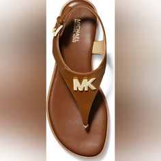 Mk Brady Lugguage Sandal Size 10 Spring Round Toe Sandals With Logo, Leather Open Toe Sandals With Logo, Leather Sandals With Logo For Spring, Spring Leather Sandals With Logo, Michael Kors Ankle Strap Sandals With Branded Insole, Michael Kors Leather Sandals With Cushioned Footbed, Michael Kors Synthetic Sandals With Branded Insole, Michael Kors Flat Sandals, Michael Kors Brown Leather Sandals