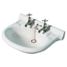 two faucets are attached to the side of a white sink with chains hanging from it