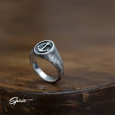 Introduce an air of timeless elegance with our Anchor Signet Ring, a rustic oxidized pinky ring that beautifully combines vintage charm with modern masculinity. Perfect as a unique men's wedding band or a thoughtful engagement and anniversary gift for your boyfriend, this striking piece features an intricate anchor design that symbolizes steadfastness and love. The rich patina provides a distinctive character, making it a conversation starter that captures the essence of adventure and authentici Mens Rings Wedding, Band Boyfriend, Anchor Rings, Steampunk Rings, Oxidized Ring, Silver Certificate, Mens Rings, Ring Mens, Unique Wedding Bands