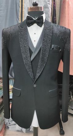 Elevate your wardrobe with our exquisitely crafted custom-tailored set, including every item as pictured. This set includes a hand-embroidered coat, a perfectly tailored waistcoat, a crisp tuxedo shirt with elegant cufflinks, tailored trousers, and a sophisticated bow tie--everything you need to achieve a refined and complete look Client Order as pictured. Experience classy elegance with our black-hand embroidered suit, meticulously tailored to your exact measurements.  For a truly personalized fit, kindly provide your body measurement in inches.  1 - Jacket Length 2 - Chest  3 - Stomach  4 - Hip 5 - Shoulder to Shoulder 6 - Sleeve Length 7 - Arm Hole 8 - Biceps (Curled) 9 - Wrist Pant Measurement: - 1 - Waist 2 - Hip 3 - Thigh 4 - Length 5 - Bottom Production takes two weeks, with an addi Embellished Suit Men, Black Prom Suits For Guys, Reception Tuxedo, Tuxedo Peak Lapel, Embroidery With Pearls, Black Prom Suits, Suits For Guys, Three Piece Suits, Tailored Waistcoat