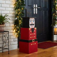 a cardboard nutcracker is sitting in front of a door