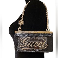 This Rare Gucci Clutch Is Pushing Its Way Into Vintage Status, Featuring A Gold-Tone Gucci Logo At The Front, Embellished With Sparkling Crystals. Made From Mixed Materials Including Python, Leather, And Satin. Gold-Tone Buckle Hardware And Beautiful Chain. Snap Button Fastening At The Flap Closure. Gold-Tone Chain Strap With Logo Disc. Dust Bag, Original Box, And All The Tags Are Included. "Starlight" Met, Black Python, Black Leather, Black Satin And Purple Satin Inside Interior. This Bag Was P Gold Gucci Party Bag, Trendy Gucci Evening Bags, Gucci Party Bags, Gucci Leather Party Bag, Gucci Clutch Bag, Navy Clutch, Black Clutch Bags, Black Python, Gucci Clutch