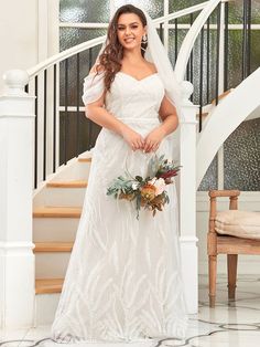 a woman in a wedding dress posing for the camera