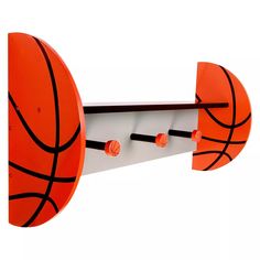 an orange and white shelf with basketballs on it