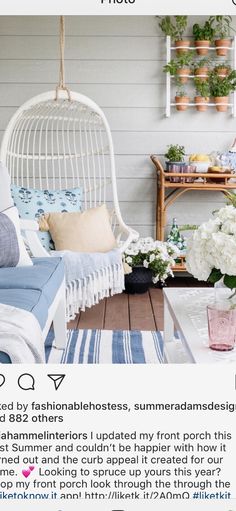 a white wicker chair sitting on top of a wooden floor next to a table