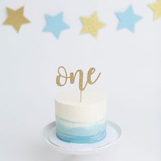 a cake with the word one on top