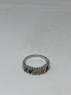 Lovely and delicate Bohemian ring 925 Sterling silver Deco ring set with genuine citrine, amethyst peridot, garnet and blue topaz Size 8 but can be re sized for you on request by laser. My jeweler charges $10-$20 All rings are shipped in a nice gift box. Check out our over a THOUSAND great reviews Engraving is $4 per letter and is not always perfect depending on the piece. It can take a few days if the jeweler is busy. This is payable to Paypal Judithsltd@gmail.com Rainbow Promise Ring With Accent Stones, Silver Multi-stone Sterling Silver Cluster Ring, Silver Multi-stone Cluster Ring In Sterling Silver, Silver Multi-stone Diamond Promise Ring, Silver Multi-stone Diamond Ring For Promise, Silver Multi-stone Promise Ring, Silver Multi-stone Open Diamond Ring, Rainbow Sterling Silver Promise Ring, Silver Multi-stone Open Birthstone Ring