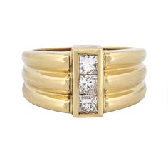 Embrace Timeless Sophistication With The Modern Diamond Statement Ring In 18k Yellow Gold, Signed By Js. This Elegant Piece, In Excellent Condition, Showcases A Sleek Design Featuring Three Bezel-Set Princess Cut Diamonds At The Center, Boasting Vs Clarity And G Color. The Ring's Striking Yet Refined Style Makes It A Versatile Addition To Any Jewelry Collection, Perfect For Both Everyday Elegance And Special Occasions. The 11.5mm Width And 4mm Height Offer A Substantial Presence Without Overwhelming, While The Total Carat Weight Of Approximately 0.45 Carats Ensures A Brilliant Sparkle. Product Details: * Designer: Js * Metal: 18k Yellow Gold * Stone: Diamond * Total Carat Weight: 0.4 Designer Yellow Gold Brilliant Cut Diamond Ring, Designer Yellow Gold Diamond Ring With Brilliant Cut, Luxury Yellow Gold Channel Set Diamond Ring, Designer Yellow Gold Rings For Formal Occasions, Designer Yellow Gold Diamond Ring With Vvs Clarity, Luxury Yellow Gold Rings With Channel Set, Luxury Yellow Gold Channel Set Rings, Formal Yellow Gold Diamond Ring With Channel Set, Yellow Gold Rings With Single Diamond For Everyday Luxury