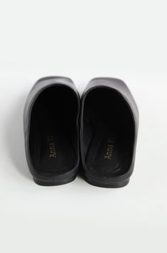 Slippers made of real leather. Get them for a chic and comfy look! Chic Leather Slip-on Mules, Sleek Closed Toe Mules With Leather Sole, Chic Slip-on Mules With Leather Footbed, Casual Flat Mules With Padded Heel, Sleek Closed Toe Mules With Removable Insole, Chic Closed Toe Slippers With Leather Sole, Classic Open Toe Mules, Sleek Mules With Leather Sole And Round Toe, Sleek Mules With Round Toe And Leather Sole