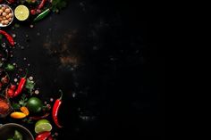 an overhead view of various fruits and vegetables on a black background with space for text