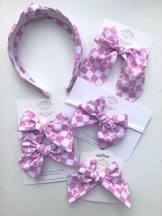 Super cute mouse accessories with a pink and white checkered pattern. Comes in a nylon headband, or bow on an alligator clip, or tie knot headband! Any of these would be perfect for a trip to the happiest place on earth! Fun Pink Hair Accessories For Spring, Playful Pink Headband For Summer, Cute Pink Bow Headband As Gift, Cute White Headband With Pink Bow, Playful Bow Headband For Gift, Cute Pink Bow Headband, Playful Summer Hair Accessories With Bow, Playful White Bow With Matching Headband, Playful Bow Hair Accessories For Summer