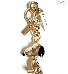 Coach X Peanuts Snoopy Bag Charm Keychain Gold Tone New with Tags. Condition is New with tags. Shipped with USPS First Class. Coach Purse Charms, Coach Bag Charm, Coach Peanuts Collection, Ig Tone, Snoopy Bag, Gold Logo Charm Bag Charm, 2024 Manifesting, Peanuts Charm, Coach Keychain