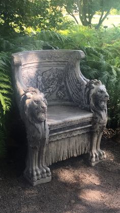 a stone bench with two lions on it