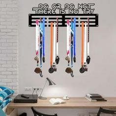 a wall mounted to the side of a desk with skis hanging from it's hooks