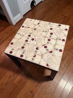 a coffee table with some type of book on it in the middle of a room