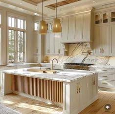 a large kitchen with an island in the middle and lots of cabinets on both sides