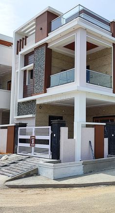 an apartment building with multiple balconies on the second floor