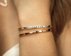 Spread love and radiate luxury wherever you go with Mini Luxe Cuffs. These elevated fine metal cuff bracelets allow your most precious messages to truly shine. Select your 1/8” wide Mini Luxe Cuff in .925 Sterling Silver, 14 karat Gold Filled, or 14 karat Rose Gold Filled, because what you have to say is worth casting forever in gold. You may choose not to personalize your Luxe Cuff or add a personalized message up to 15 characters. Each character in your message will be individually hand cast, Metal Cuff Bracelet, Bold Necklace, Metal Bracelet, Wide Band Rings, Timeless Gifts, Hand Cast, Spread Love, Metal Bracelets, Sterling Silver Heart